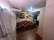 Comfortable bedroom featuring built-in closet storage and an air conditioning unit at 4582 Hendrix Dr, Forest Park, GA 30297