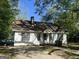 Charming one-story home with a walkway leading to the front door and a chimney at 4582 Hendrix Dr, Forest Park, GA 30297
