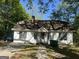 Charming one-story home with a walkway leading to the front door and a chimney at 4582 Hendrix Dr, Forest Park, GA 30297