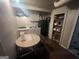Compact kitchen featuring gray cabinets, a black refrigerator, and a cozy dining area at 4582 Hendrix Dr, Forest Park, GA 30297