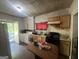 View of the functional kitchen with table, appliances, and natural light at 4582 Hendrix Dr, Forest Park, GA 30297