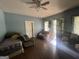 A living room featuring wood floors, furniture, and natural light at 4582 Hendrix Dr, Forest Park, GA 30297