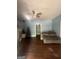 Living room featuring wood floors, furniture, and decorated Christmas tree at 4582 Hendrix Dr, Forest Park, GA 30297