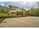 Backyard features an outdoor basketball court and multi-level patio and deck at 345 Phillips Dr, Fayetteville, GA 30214