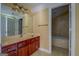Bathroom showcases neutral tones and a large mirror with an adjacent tiled shower at 345 Phillips Dr, Fayetteville, GA 30214