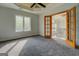 Bright bedroom boasts tray ceilings and an adjacent hallway entrance at 345 Phillips Dr, Fayetteville, GA 30214