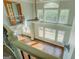 View from the staircase down to the foyer and formal living room with a lot of natural light at 345 Phillips Dr, Fayetteville, GA 30214