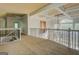 Hallway with tray ceilings, white trim, and iron railing at 345 Phillips Dr, Fayetteville, GA 30214