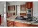 Gourmet kitchen with a center island cooktop and stainless steel double ovens at 345 Phillips Dr, Fayetteville, GA 30214