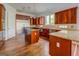 Spacious kitchen with hardwood floors, stainless steel refrigerator and granite countertops at 345 Phillips Dr, Fayetteville, GA 30214