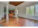 Open living area with hardwood floors and natural light entering from adjacent kitchen at 345 Phillips Dr, Fayetteville, GA 30214