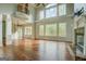 Spacious living room with hardwood floors, large windows, and a fireplace at 345 Phillips Dr, Fayetteville, GA 30214
