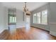 Living room with chandelier and large windows offering natural light and outdoor views at 345 Phillips Dr, Fayetteville, GA 30214