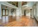 Open-concept living room with hardwood floors, staircase, and grand entrance at 345 Phillips Dr, Fayetteville, GA 30214