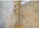 Walk-in shower featuring travertine tile surround, and custom shower head at 345 Phillips Dr, Fayetteville, GA 30214