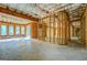 Unfinished basement displays exposed beams and natural light through large windows at 345 Phillips Dr, Fayetteville, GA 30214