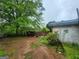 Rustic backyard with a weathered wooden fence and lush foliage at 30 Millwood Dr, Covington, GA 30016
