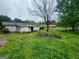 Backyard featuring a pile of dirt and overgrown grass at 30 Millwood Dr, Covington, GA 30016