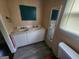 Bathroom featuring a double sink vanity with a mirror and toilet at 30 Millwood Dr, Covington, GA 30016