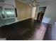 Bedroom with hardwood floors, ceiling fan and door that leads to closet at 30 Millwood Dr, Covington, GA 30016
