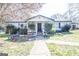 Charming single-story home with front yard and sidewalk leading to entryway at 30 Millwood Dr, Covington, GA 30016