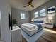 Inviting bedroom with large windows, neutral tones, hardwood floors, and a cozy, bright ambiance at 1745 Rockbridge Nw Rd, Conyers, GA 30012