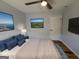 Serene bedroom featuring a large bed, hardwood floors, ambient lighting, and modern decor at 1745 Rockbridge Nw Rd, Conyers, GA 30012