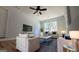 Modern living room with ample seating, neutral tones, hardwood floors, and stylish decor accents at 1745 Rockbridge Nw Rd, Conyers, GA 30012