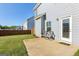 Cozy back patio with chairs, ideal for outdoor relaxation and entertaining at 255 Orchid Dr, Mcdonough, GA 30252