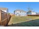 Spacious backyard featuring a well-maintained lawn and a wood fence for added privacy at 255 Orchid Dr, Mcdonough, GA 30252