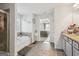 Spacious ensuite bathroom featuring a soaking tub, vanity, and neutral colors throughout at 255 Orchid Dr, Mcdonough, GA 30252