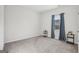 Spacious bedroom with carpet flooring, blue curtains, one window, and base table at 255 Orchid Dr, Mcdonough, GA 30252