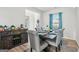 Dining room with hardwood floors, gray chairs and dining table, and accent cabinet at 255 Orchid Dr, Mcdonough, GA 30252