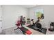 Bright exercise room filled with natural light and showcasing stationary bike and weight bench at 255 Orchid Dr, Mcdonough, GA 30252