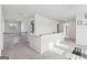 Bright hallway with neutral walls, carpet flooring, and natural light streaming in from a nearby window at 255 Orchid Dr, Mcdonough, GA 30252