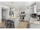 Bright kitchen features gray cabinets, stainless steel appliances, granite countertops, and hardwood style floors at 255 Orchid Dr, Mcdonough, GA 30252