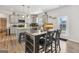 Bright kitchen featuring modern gray cabinetry, stainless steel appliances, and a large island with bar seating at 255 Orchid Dr, Mcdonough, GA 30252