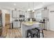 Bright kitchen features gray cabinets, stainless steel appliances, granite countertops, and hardwood style floors at 255 Orchid Dr, Mcdonough, GA 30252
