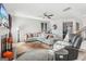 Spacious living room with modern furnishings, a ceiling fan, and plenty of natural light at 255 Orchid Dr, Mcdonough, GA 30252