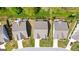 Aerial view of suburban homes with well-maintained lawns and a serene neighborhood setting at 5910 Stellata Cir, Cumming, GA 30028