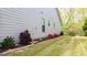 Spacious backyard with a well-manicured lawn, garden beds and beautiful landscaping around the house at 5910 Stellata Cir, Cumming, GA 30028