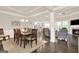 The dining room has hardwood floors, wainscoting, and a light fixture at 5910 Stellata Cir, Cumming, GA 30028