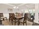 Dining room featuring hardwood floors, and a light fixture at 5910 Stellata Cir, Cumming, GA 30028