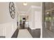 Elegant foyer showcasing hardwood floors, decorative molding, and an open view into the adjacent living spaces at 5910 Stellata Cir, Cumming, GA 30028