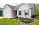 Charming exterior featuring a well-manicured lawn and appealing landscaping around the entrance at 5910 Stellata Cir, Cumming, GA 30028