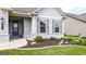 Inviting exterior with a landscaped front yard leading to a charming covered entrance at 5910 Stellata Cir, Cumming, GA 30028