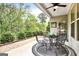 Outdoor patio featuring seating for four and a view of the trees at 5910 Stellata Cir, Cumming, GA 30028