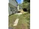 Partially fenced backyard with a small patio area, perfect for grilling and entertaining at 390 Hulan Way, Lawrenceville, GA 30044