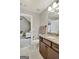 Neutral bathroom with granite countertop vanity and view into a cozy living space at 185 Discovery Lake Dr, Fayetteville, GA 30215