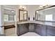 Bathroom featuring a granite countertop double vanity, large mirror, and an adjoining bedroom at 185 Discovery Lake Dr, Fayetteville, GA 30215